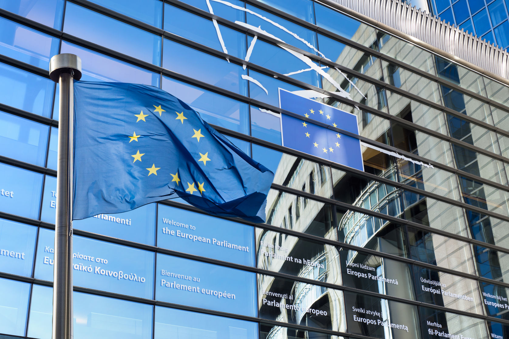 european union flag against european parliament